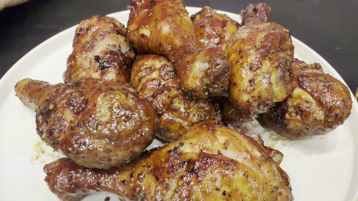 Plate of Texas bourbon and molasses glazed chicken drumsticks